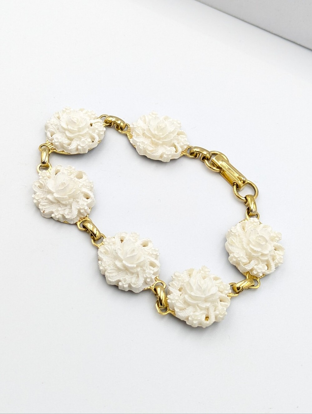 Vintage carved white flower gold tone panel bracelet